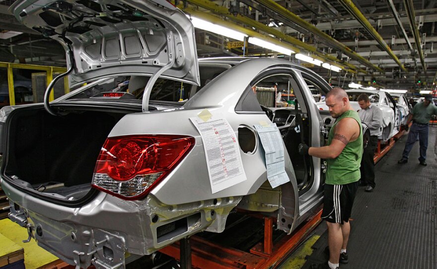 An employee at the General Motors Lordstown Assembly Plant in Lordstown, Ohio, assembles a test model of the new Chevrolet Cruze. About 70 percent of Lordstown's tax revenue comes form workers at the GM plant.