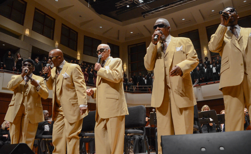 The program features the five-time Grammy-winning Blind Boys of Alabama with conductor Dr. Henry Panion, III, and a full symphony orchestra.