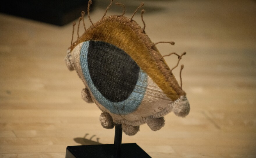 Maryam Bayat's eye sculpture, made from an old Persian rug, is shown on March 9, 2026.