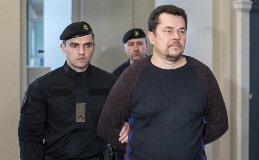 Evaldas Rimasauskas walks into court in May in Vilnius, Lithuania. On Monday, the court ruled that Rimasauskas, allegedly behind a massive email scheme, must be extradited to the U.S. to stand trial.