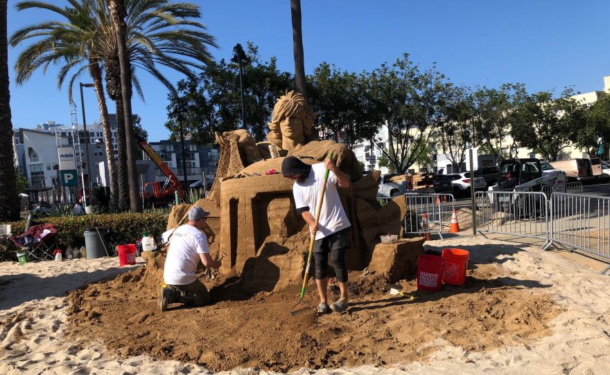 People build sand sculptures as part of Audible's offsite Comic-Con activation, "The Audible Beach." San Diego, Calif. July 18, 2022.