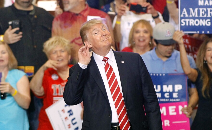 President Trump gestures during a rally at the Phoenix Convention Center Tuesday night.