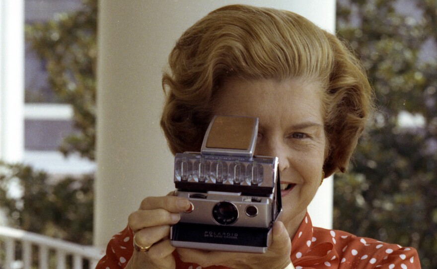 First Lady Betty Ford taking a Polaroid photo at the White House. (undated photo)