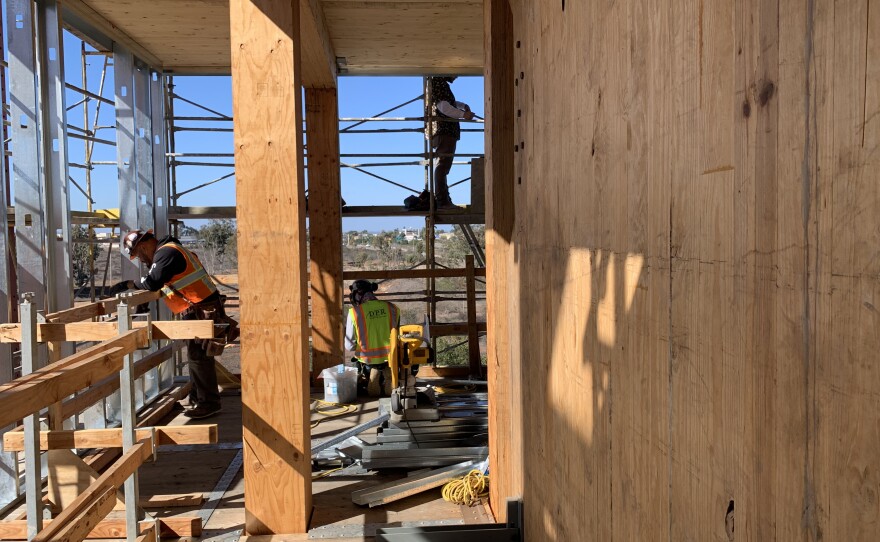 Construction workers assemble the NHERI Tall Wood Project test building made from mass timber, Oct. 26, 2022.