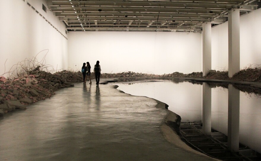 Silent Ink features a waterfall of ink plunging into a 5,300-gallon lake excavated from the museum's floor. It's hard to view the installation for very long, because the smell of the ink becomes overpowering.