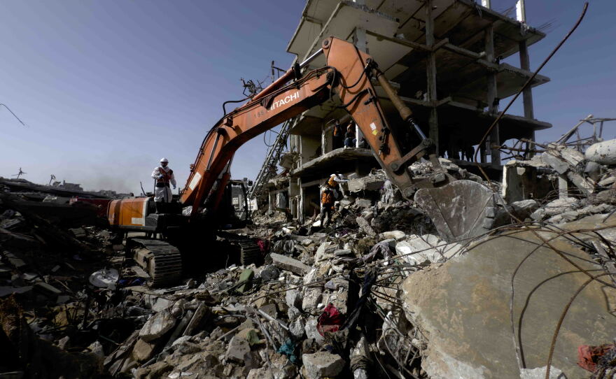 There is only one functioning excavator in Gaza for body recovery efforts, the International Committee of the Red Cross says, and nearly 8,000 bodies still remain under rubble from the war, the Gaza health ministry says. A Gaza civil defense crew in northern Gaza uses an excavator to dig through the rubble of the Abu Naser family home struck by Israel in October 2024, killing 132 members of the extended family.