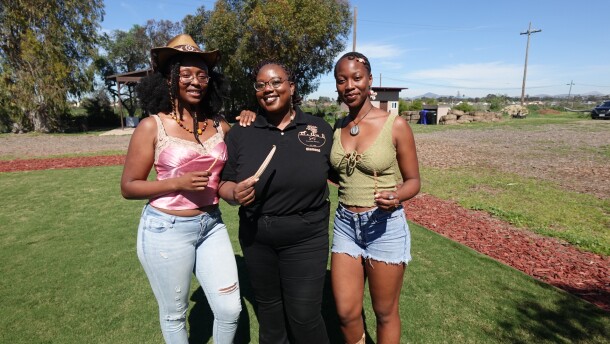 Jazzay Buncom, Diamond Brandon and Lucie Cishugi (left to right) hold red burgundy okra and black-eyed pea seeds at S&S Friendly Ranch on Feb. 27, 2026.