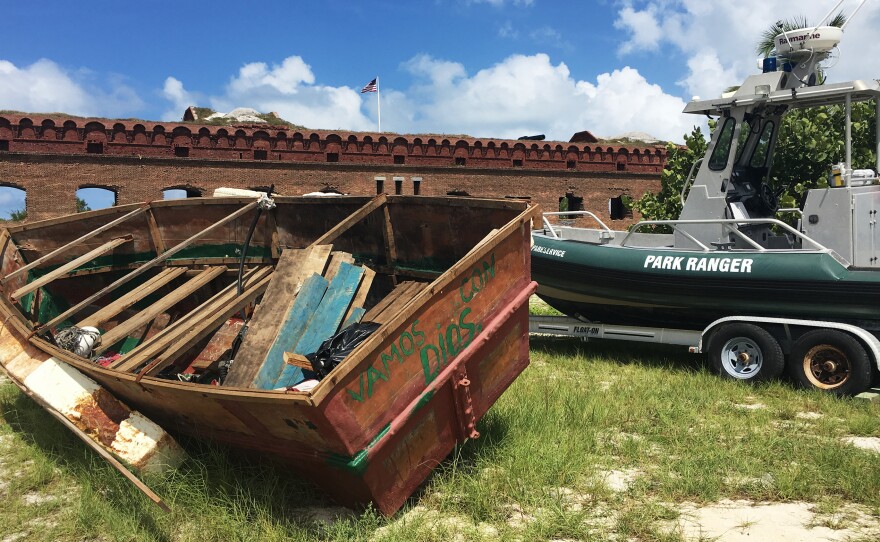 A Cuban migrant vessel (left), known as a "chug," landed recently at Dry Tortugas National Park in Florida, 70 miles from Key West in the Gulf of Mexico. The vessels are homemade and often have engine trouble.