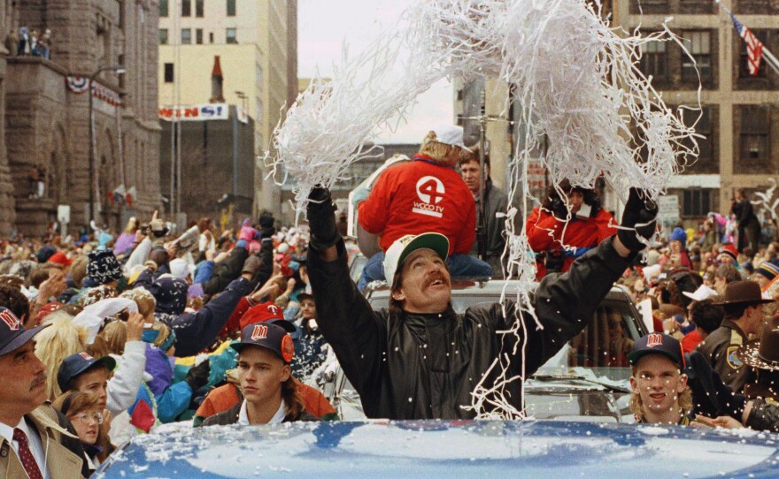 Minnesota Twins pitcher Jack Morris tosses confetti from his pickup truck during a parade celebrating the team's 1991 World Series championship.