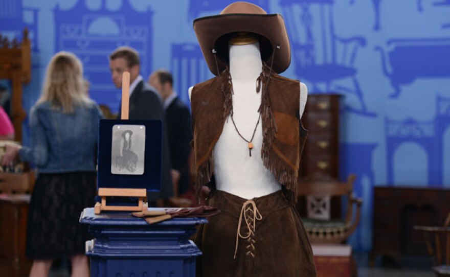 Steven Porterfield (right) appraises a ca. 1935 ranchwear outfit for $800-$1,200 in Bismarck, North Dakota.