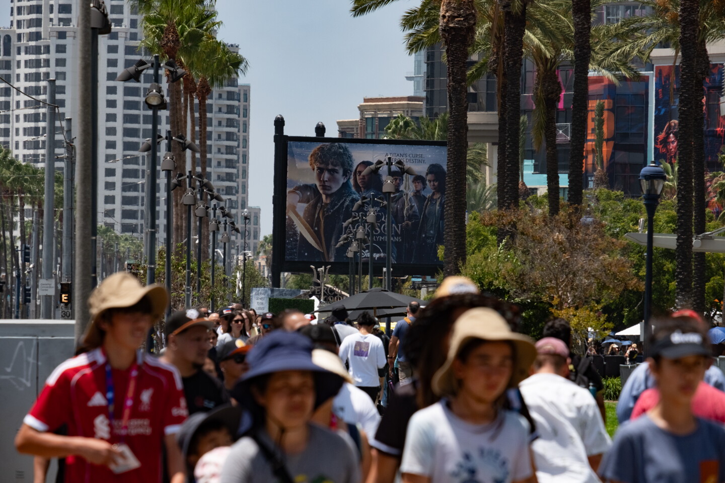 Comic-Con attendees cross the street after leaving the San Diego Convention Center, July 24, 2026.