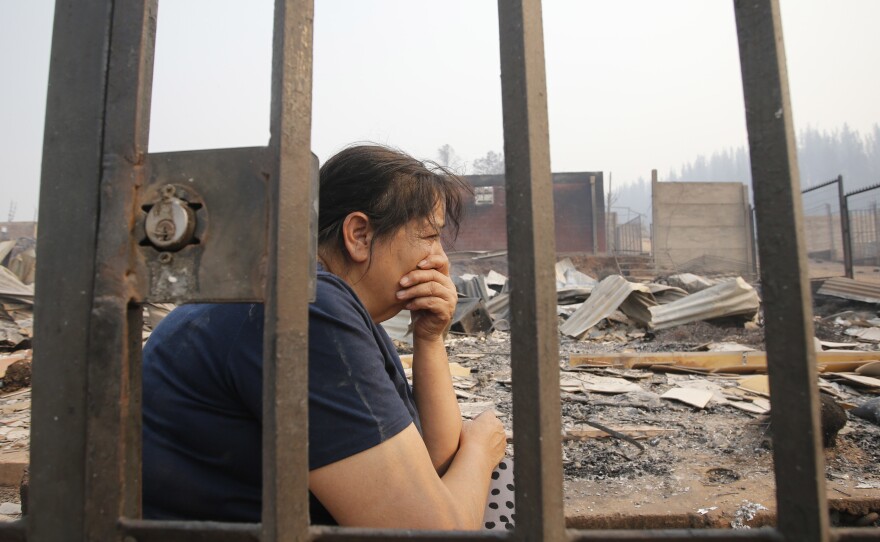 The remains of a home destroyed by fire in Santa Olga on Thursday.