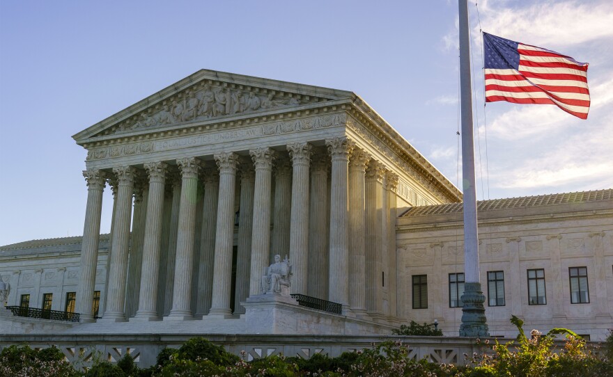 The flag flies at half-staff Saturday at the Supreme Court on the morning after the death of Justice Ruth Bader Ginsburg.