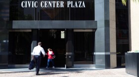 People enter the Civic Center Plaza in downtown San Diego, home to the city attorney's office, March 30, 2016. 
