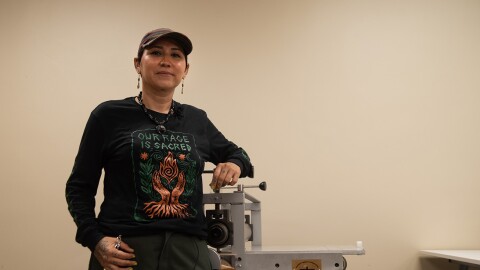 Irie Zepeda is founder of the Barrio Logan-based Por la Mano Press, shown in the new printmaking studio at the Chicano Park Museum and Cultural Center on Oct. 7, 2025. "You don't have to ask anyone else. It's just right there in front of you," they said of DIY printmaking as an art form.
