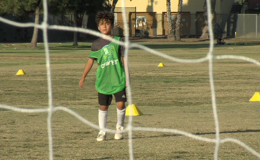 Amira Matti's brother, Matti Matti, plays soccer at YALLA, June 13, 2016.