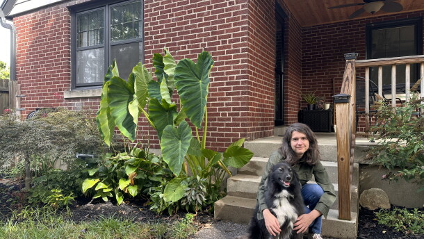 Kelly MacDonald holds her dog in front of her five bedroom home in a Cincinnati suburb on September, 11 2026.