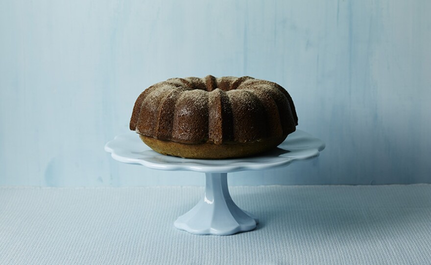 A coffee shop favorite, apple cider doughnut cake, gets a makeover with more healthful ingredients: whole-wheat flour and applesauce.