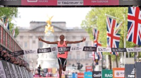 Sebastian Sawe from Kenya crosses the finish line to win the men's race at the London Marathon in London, Sunday, April 26, 2026.