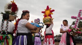 Members of the Oaxacan dance group Candela Valles Centrales get ready to perform at an event in Valley Center, California on September 21, 2025.