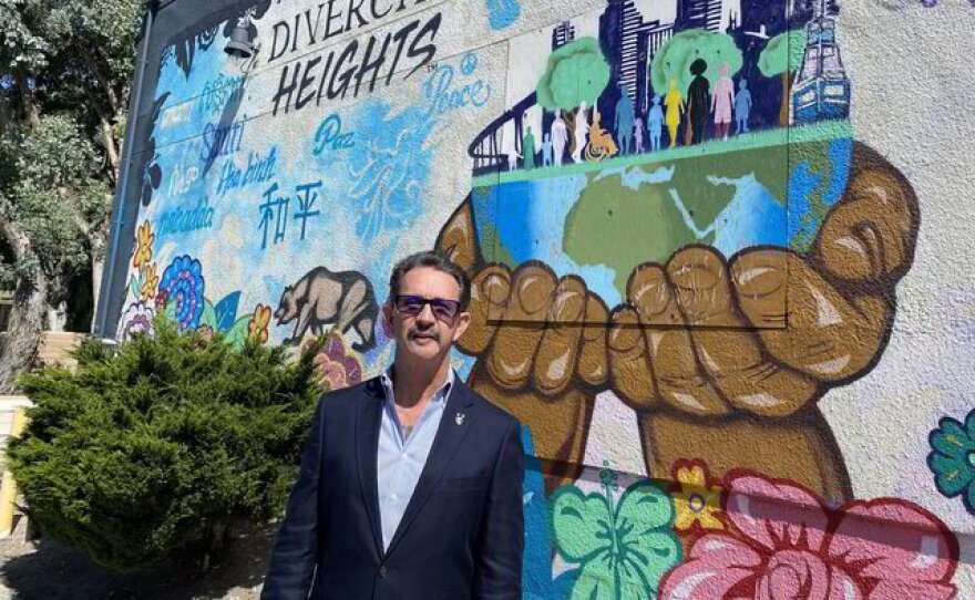 Terry Hoskins poses in front of a mural in this undated photo.