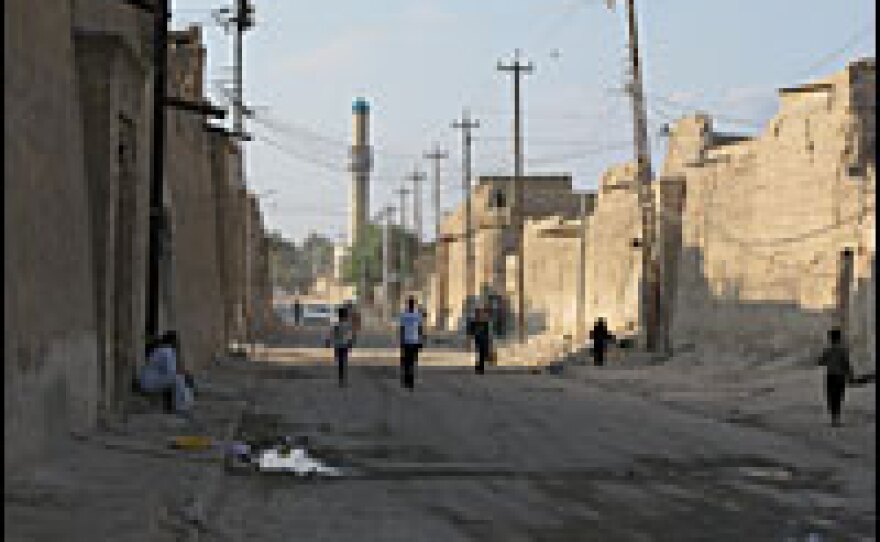 Hundreds of people live behind the crumbling facades of mud-brick buildings in Zubair.