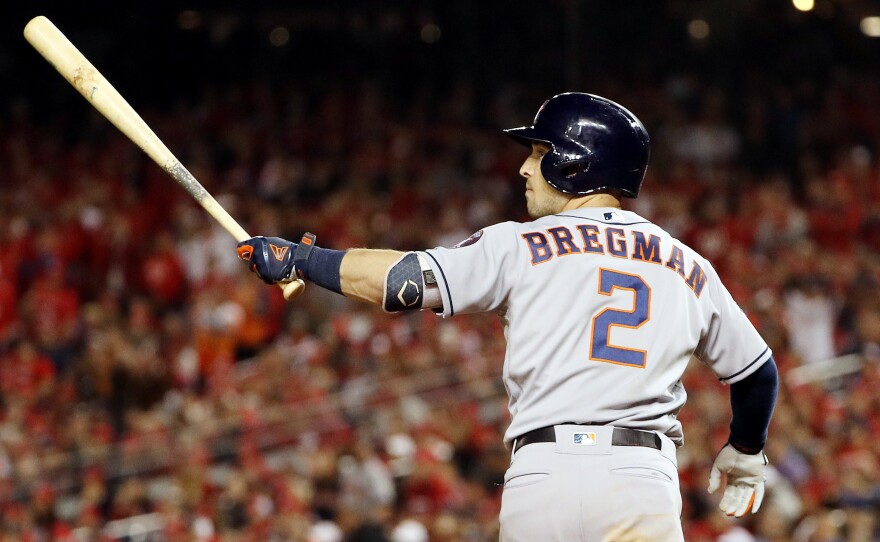 Alex Bregman of the Houston Astros hits a grand slam during the seventh inning in Game Four of the 2019 World Series at Nationals Park on Saturday. The World Series is now tied 2-2.