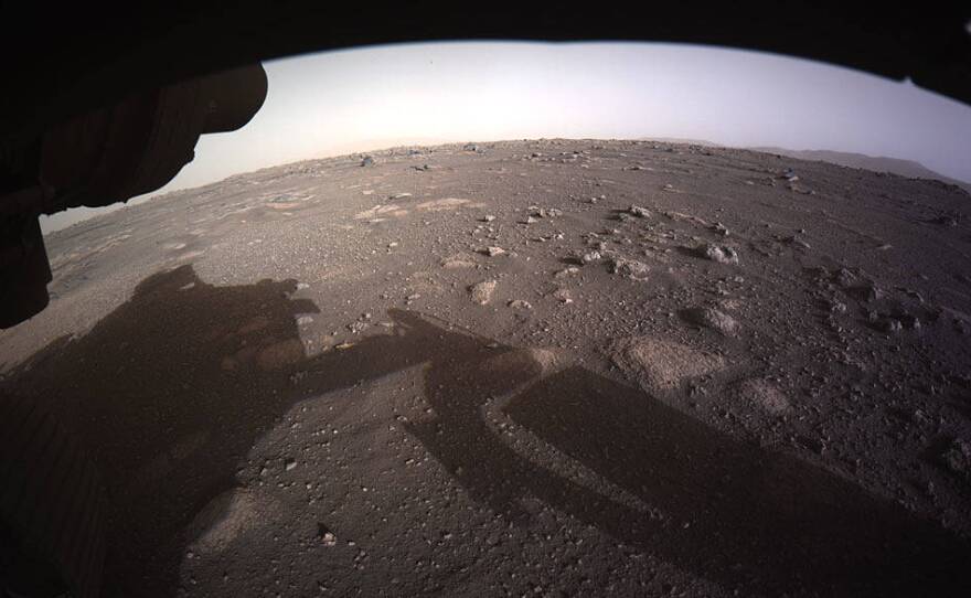 The first high-resolution full-color image of the Martian surface by Perseverance, taken by the Hazard Cameras on the underside of the rover.