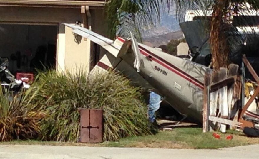 A plane is in the driveway of a Santee home after it crashed, Sept. 3, 2015.