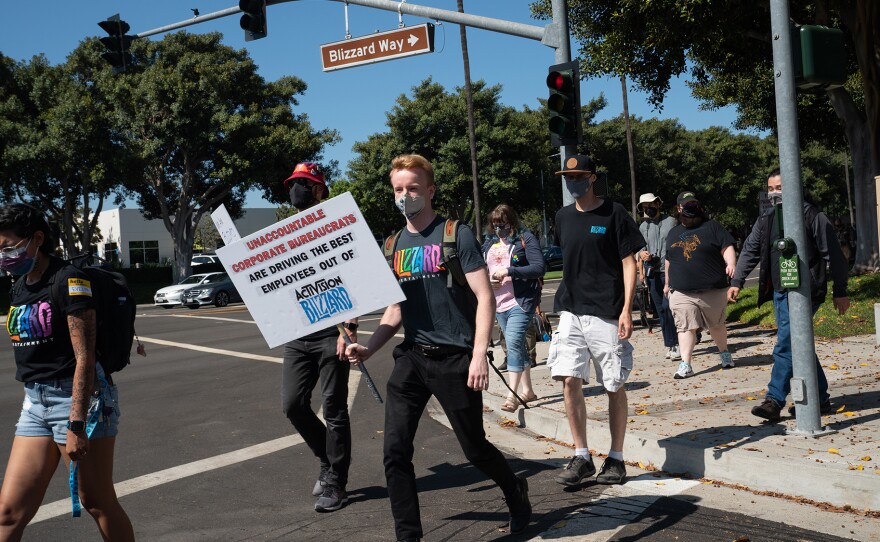 Employees walk across Blizzard Way during a walkout at Activision Blizzard offices in Irvine, Calif., on Wednesday.