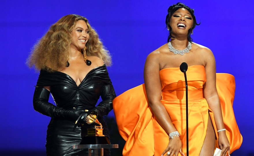 Beyoncé (left) and Megan Thee Stallion, who each won three awards at the 2021 Grammy Awards, accept trophy for best rap performance on March 14, 2021 in Los Angeles, Calif.
