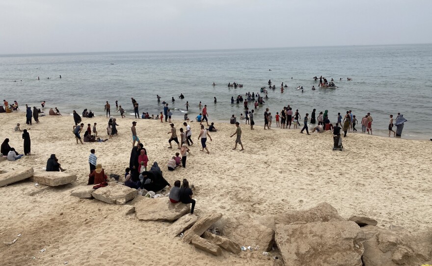 Thousands of Palestinians took to the Mediterranean Sea to cool off on Wednesday and Thursday, as temperatures topped 100 degrees in Rafah.