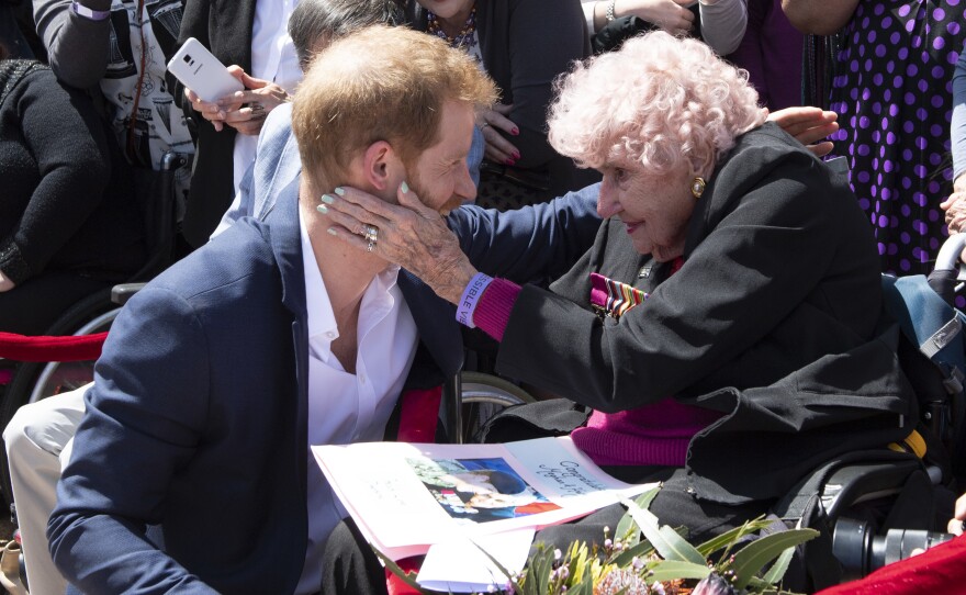 Prince Harry, Duke of Sussex greets his fan and friend Daphne Dunne in Sydney in 2018.
