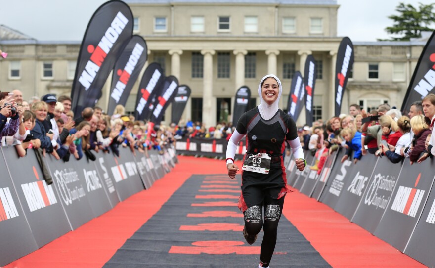 Gerami at the finish line of the half Ironman triathlon in Staffordshire.