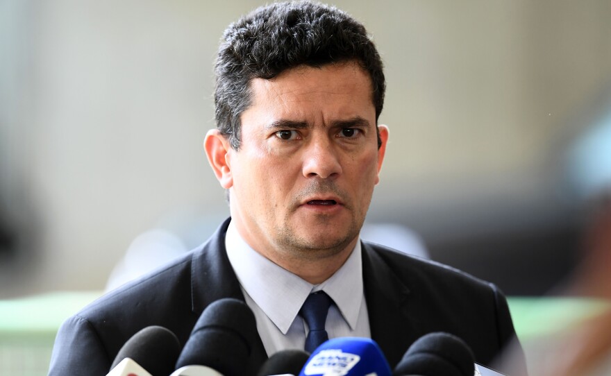 Judge Sérgio Moro, appointed by Bolsonaro as justice minister, speaks to journalists at the transitional government's headquarters in Brasília in December.