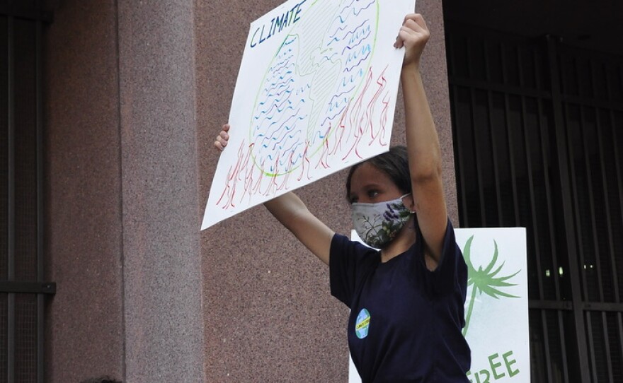 Youth climate activist Sienna Lang joins thousands of youth and adult supporters during a youth climate strike in downtown San Diego, Sept. 24, 2021.<br/>