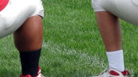 A calf comparison between Thomas Hamilton and one of his teammates.  At 5 feet 11 inches and 305 pounds, Hamilton has the traditionally thick body many Polynesian players have.