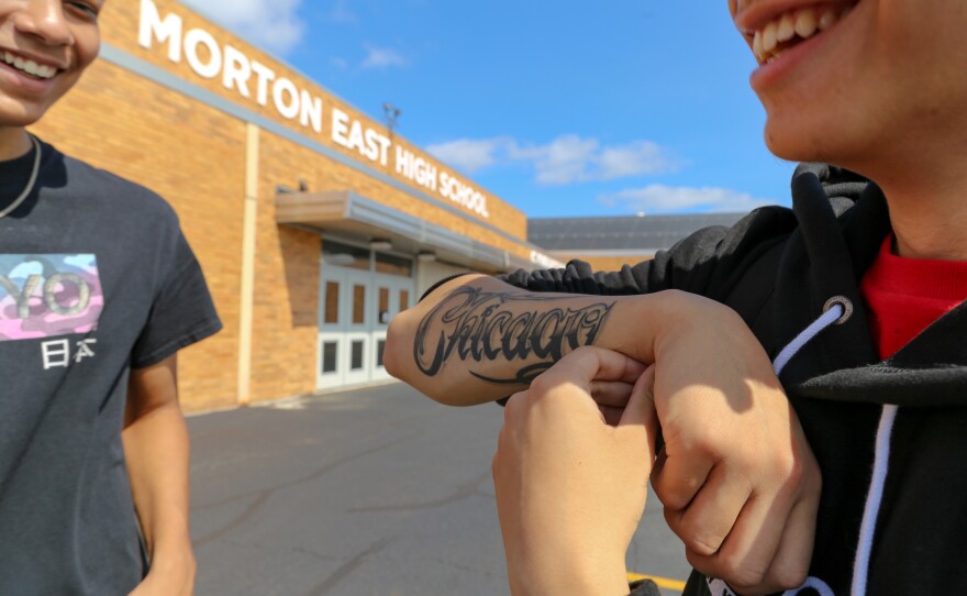 Julian Fausto shows off his "Chicago" tattoo.