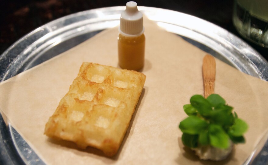 Chef Jose Carles' "Namffle," his spin on the waffle, replaces wheat flour with nampi, a vegetable. It is served with a side of plum syrup and spicy basil yogurt.