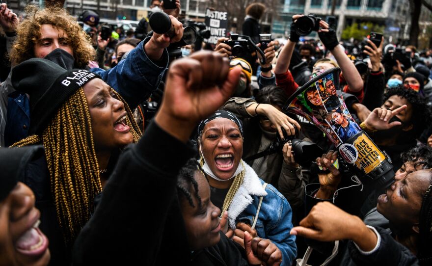 People celebrate as the verdict is announced in the trial of former police officer Derek Chauvin outside the Hennepin County Government Center in Minneapolis.