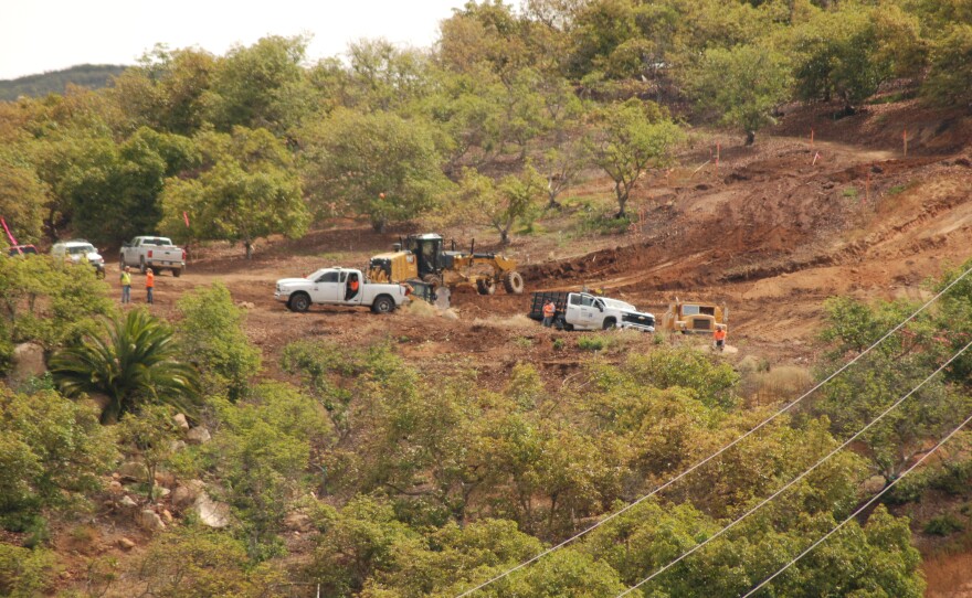Construction crews work on the Hidden Valley Ranch housing development in Poway, California on April 22, 2026.