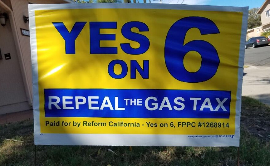 A Yes on 6 sign appears on a San Diego lawn, Aug. 29, 2018.