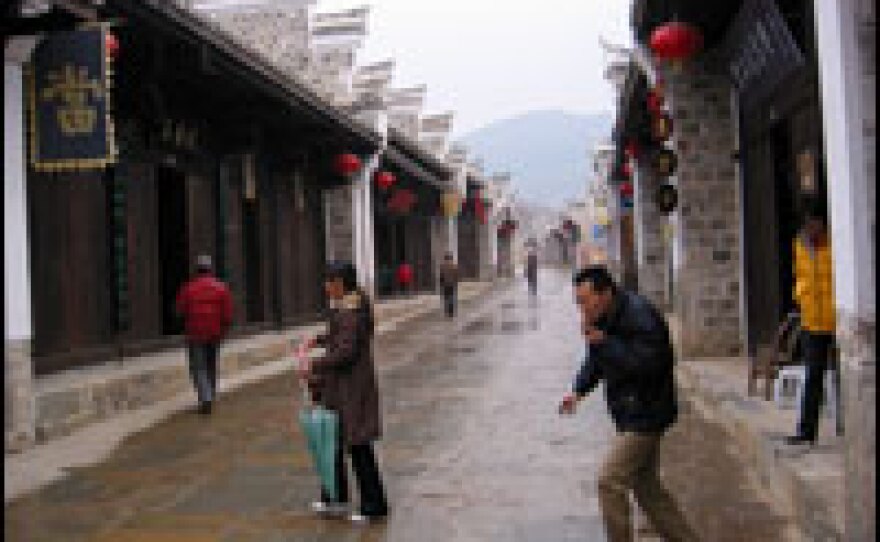 Dachang Village, a replica of an ancient settlement, has been reconstituted uphill as a sort of theme park. Residents no longer live here.