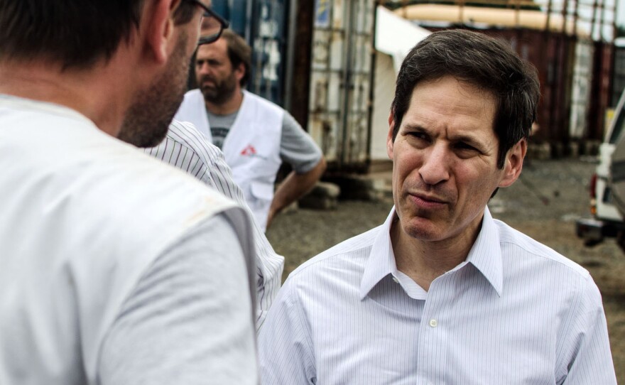 Dr. Tom Frieden, director of the CDC, talks with staff from Doctors Without Borders during a visit to the nonprofit group's newest Ebola treatment center in Monrovia, Liberia.
