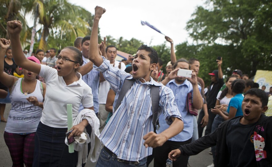 Residents shout slogans during a protest march against the construction of the planned interoceanic canal, in San Jorge, Nicaragua, in October.