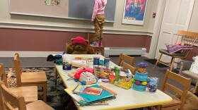 A young girl is shown staying at a shelter on Martha's Vineyard, Mass., after she and dozens of other migrants arrived by plane unannounced Wednesday.