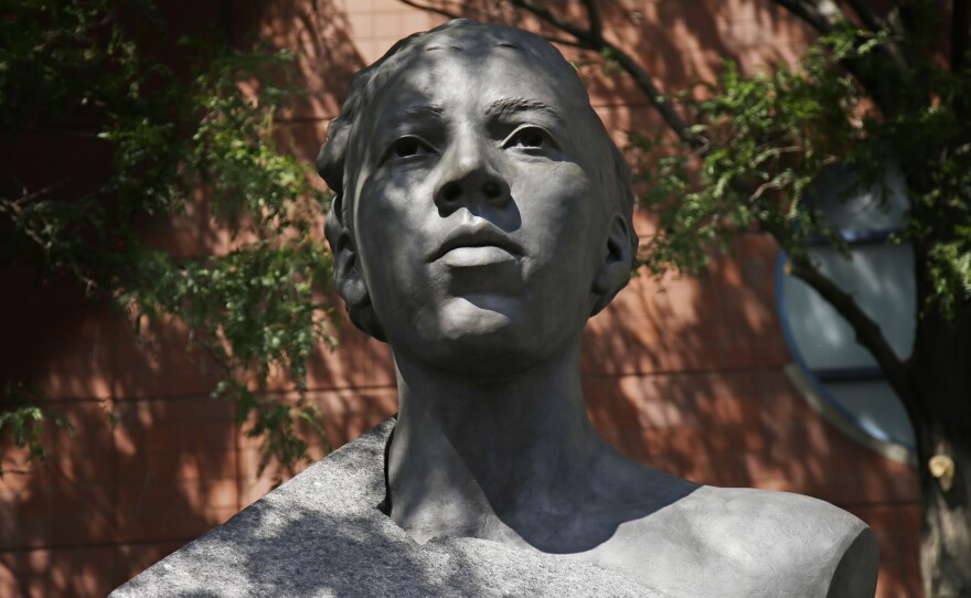 A statue of Althea Gibson sits in front of Arthur Ashe Stadium at the Billie Jean King National Tennis Center during the first round of the US Open tennis tournament in New York.