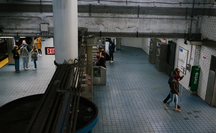 Passengers enter and exit the 2nd Street stop on the Market-Frankford Line. Many workers have not yet returned to their offices.