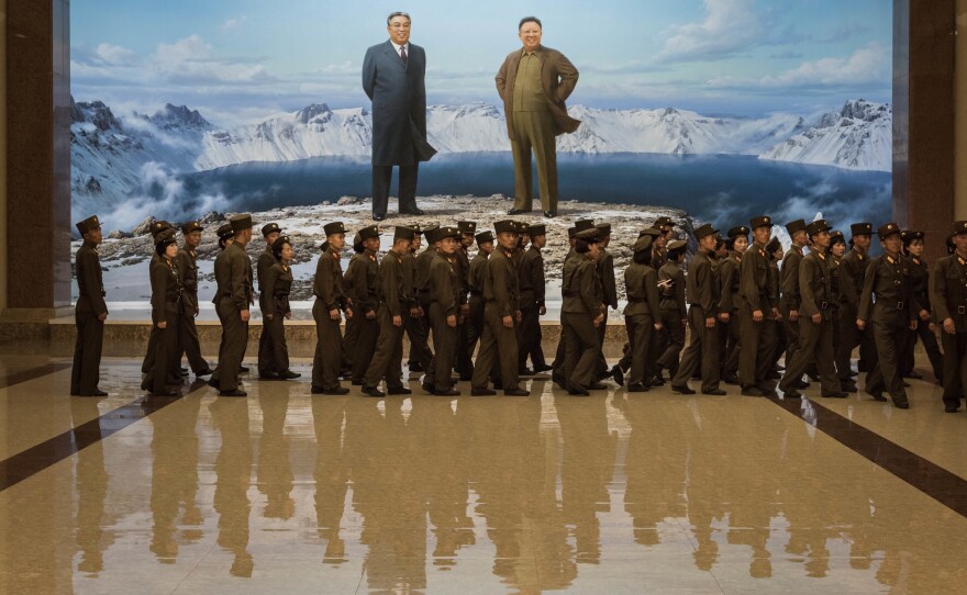 The U.S. is planning to ban American citizens from traveling to North Korea, tourism companies say. Earlier this week, Korean People's Army soldiers walked past portraits of late North Korean leaders Kim Il Sung (left) and Kim Jong Il at the Korean Revolutionary Museum in Pyongyang.