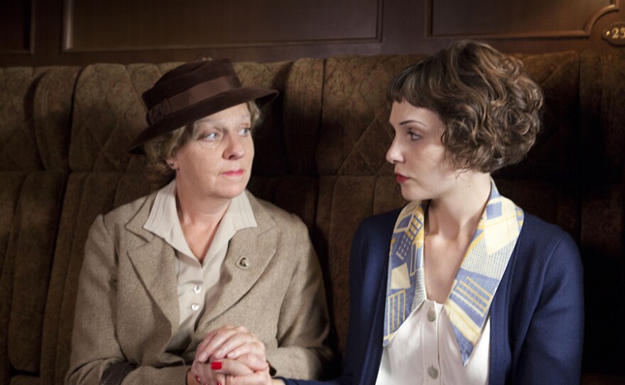 Selina Cadell as Miss Froy and Tuppence Middleton as Iris Carr. A young socialite suspects foul play when a woman inexplicably disappears from a train, in a stylish and suspenseful new adaptation of the classic thriller "The Lady Vanishes."